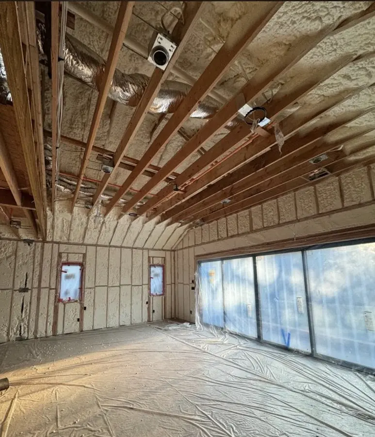 Interior walls and ceiling insulated with spray foam during new construction in Shaker Heights